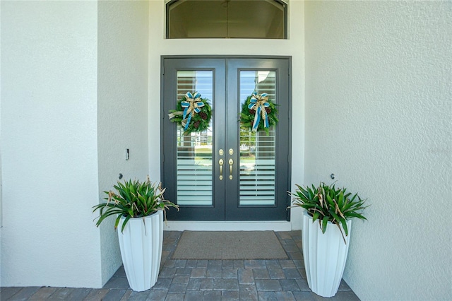 entrance to property featuring french doors