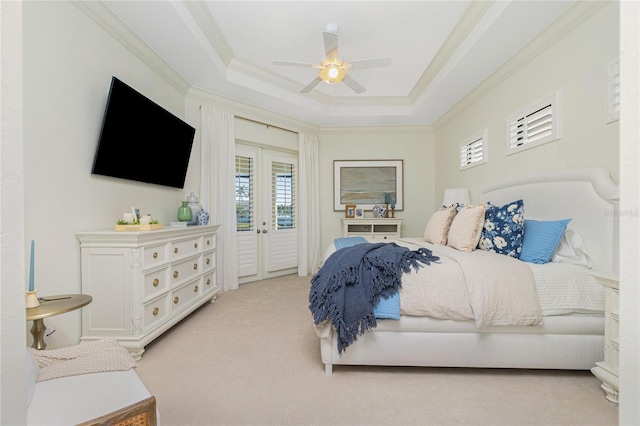 bedroom featuring access to outside, a raised ceiling, french doors, ceiling fan, and light carpet