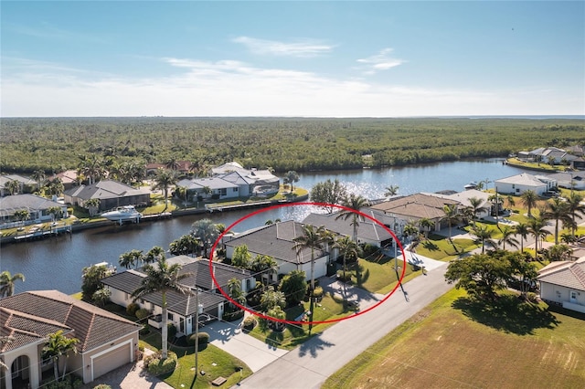 birds eye view of property featuring a water view