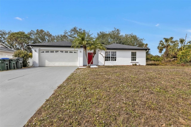 ranch-style home featuring a front lawn and a garage