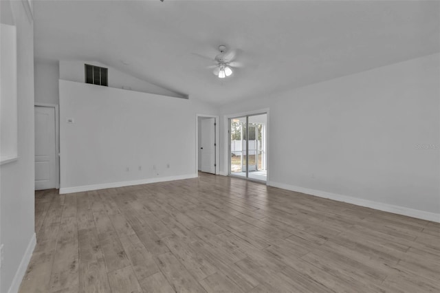 unfurnished room with ceiling fan, vaulted ceiling, and light hardwood / wood-style flooring