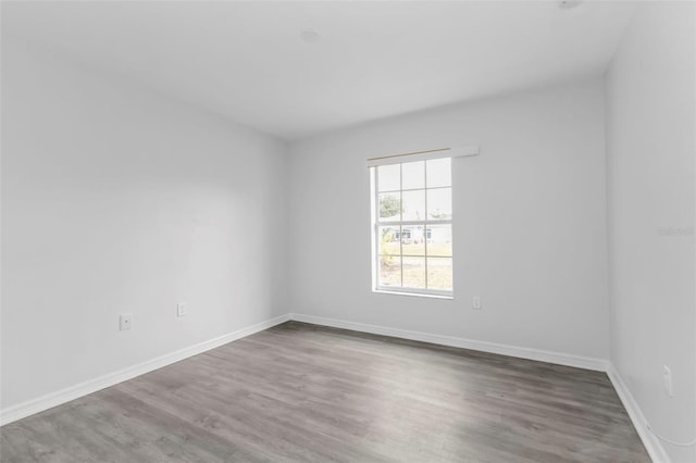 unfurnished room featuring wood-type flooring