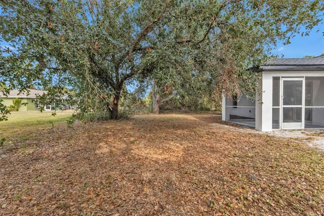 view of yard with a sunroom