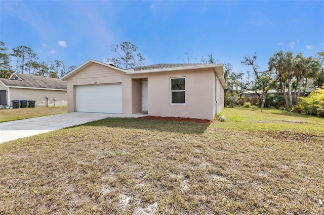 view of front of property featuring a front lawn and a garage