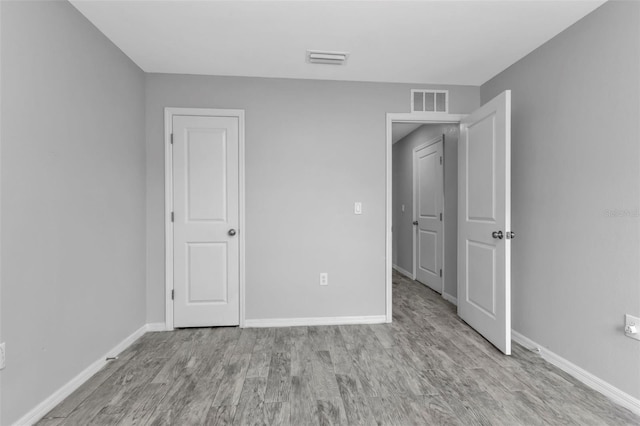 unfurnished bedroom featuring light hardwood / wood-style floors