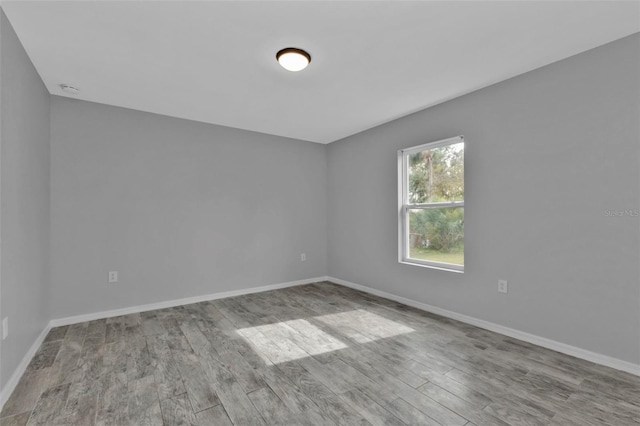 spare room featuring light wood-type flooring