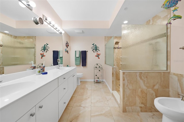 bathroom with tiled shower, a bidet, vanity, and toilet