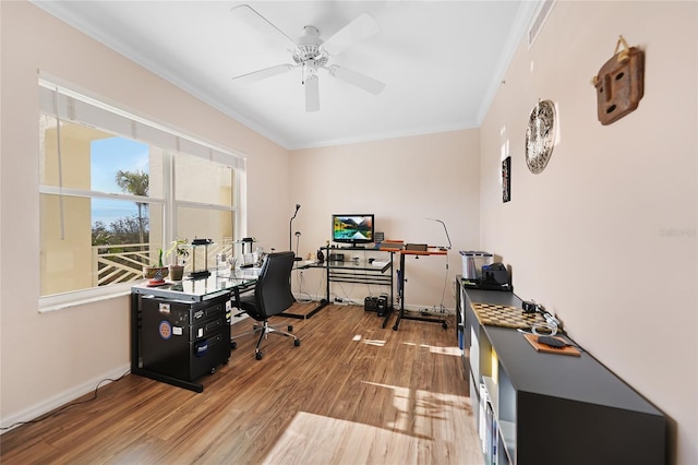 office space featuring ceiling fan, ornamental molding, and wood-type flooring