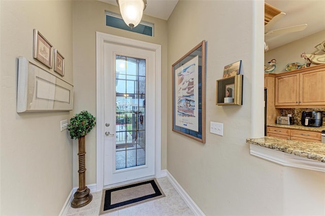 doorway with light tile patterned floors