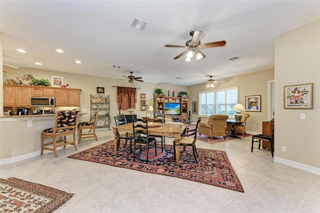 dining area featuring ceiling fan and light tile patterned floors