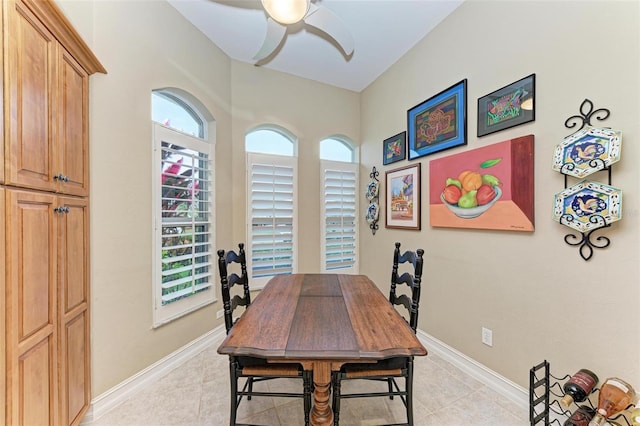 dining area featuring ceiling fan and light tile patterned floors