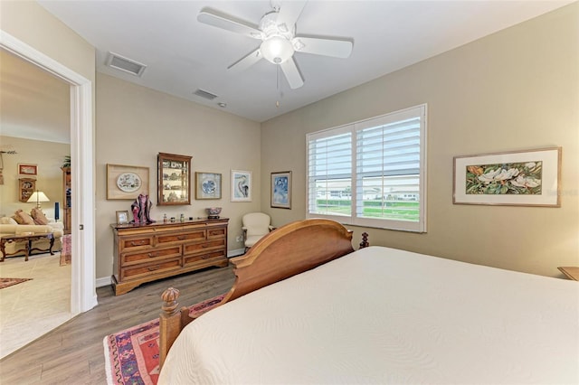 bedroom featuring ceiling fan and hardwood / wood-style flooring