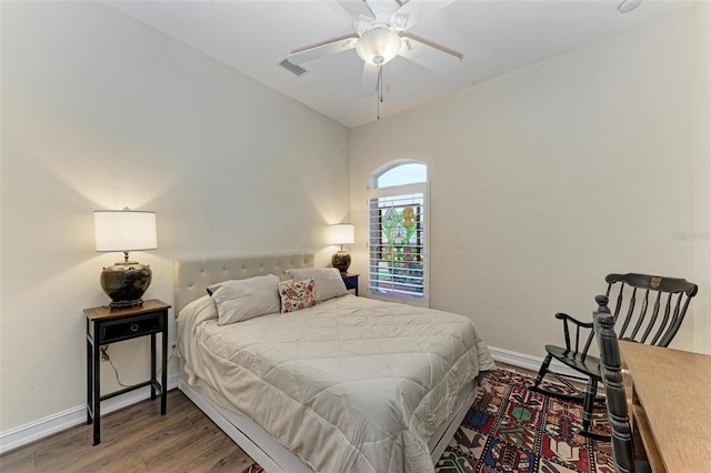 bedroom with ceiling fan and dark hardwood / wood-style floors