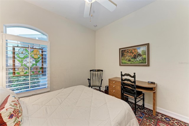 bedroom featuring ceiling fan and multiple windows