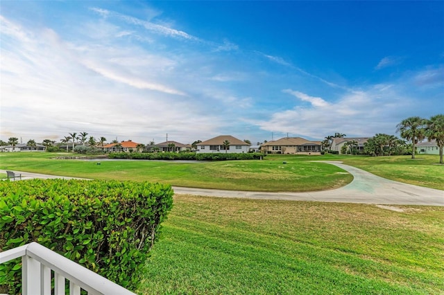 view of home's community with a lawn