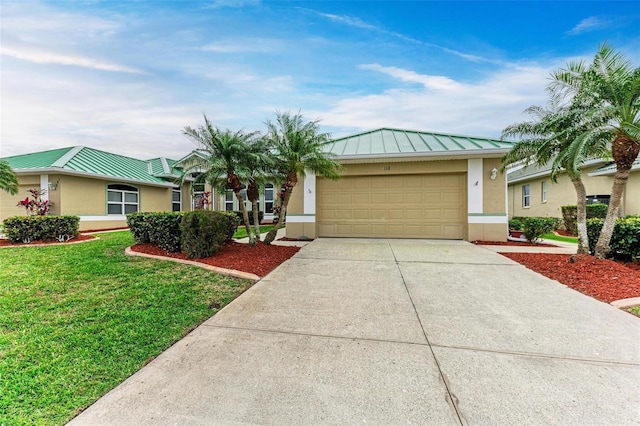 ranch-style home featuring a front lawn and a garage