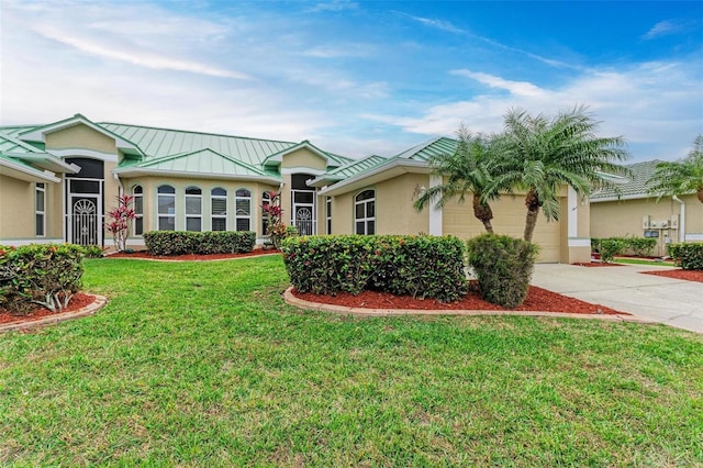 ranch-style home with a front yard and a garage