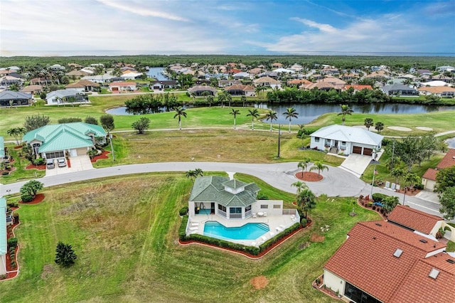 birds eye view of property with a water view