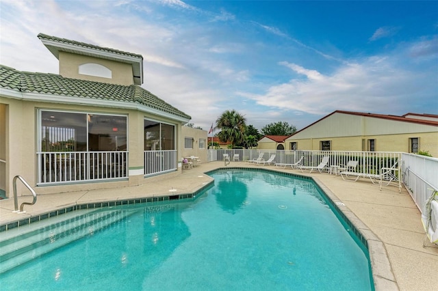 view of pool featuring a patio