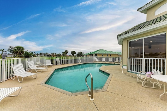 view of swimming pool featuring a patio