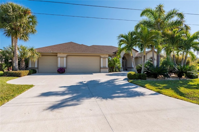 view of front of property with a front lawn and a garage