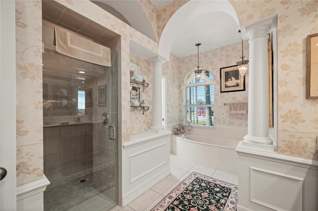 bathroom featuring ornate columns, tile patterned floors, and plus walk in shower