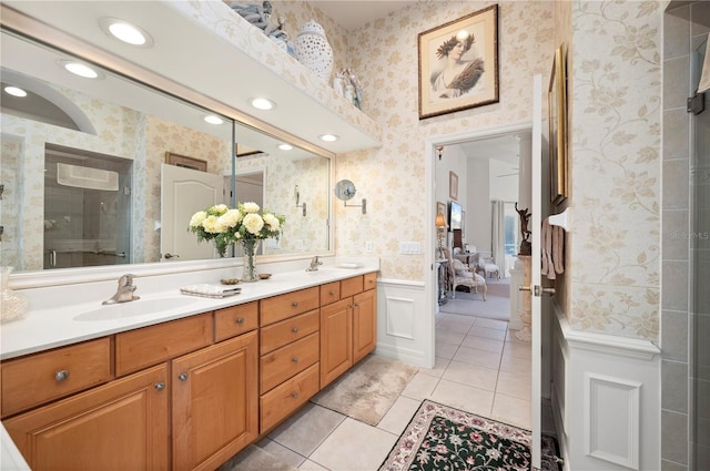 bathroom featuring tile patterned flooring and vanity