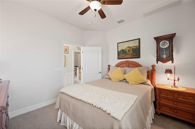 bedroom with ceiling fan and light carpet