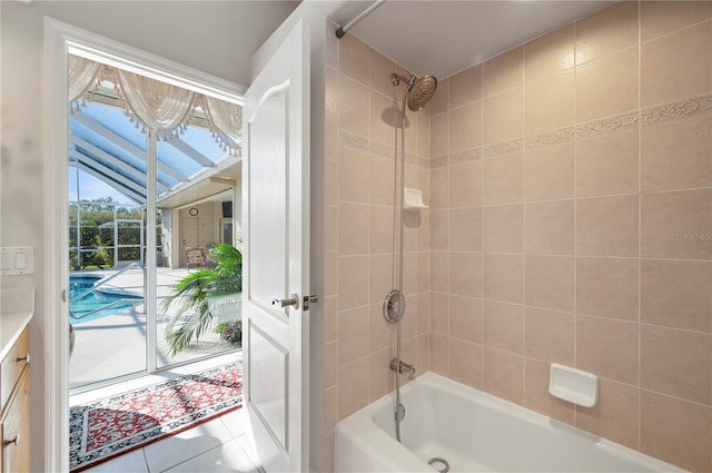 bathroom featuring tile patterned floors and tiled shower / bath