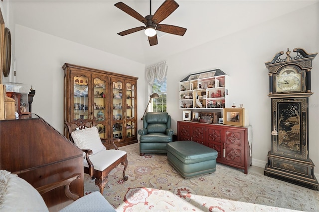 sitting room featuring ceiling fan