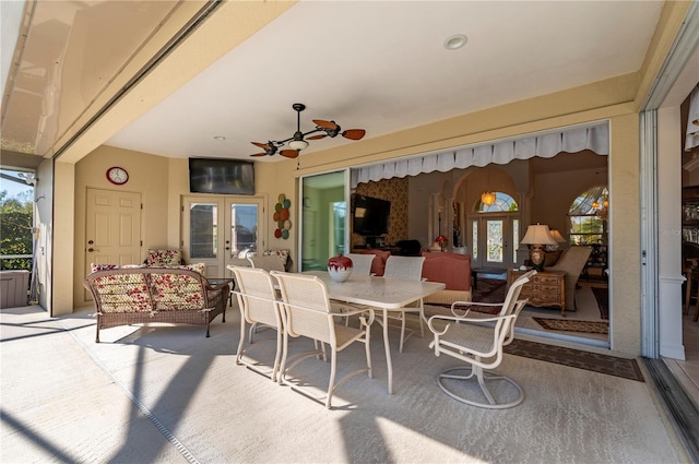 view of patio / terrace with french doors, ceiling fan, and an outdoor living space