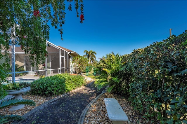 view of yard with a lanai and a patio