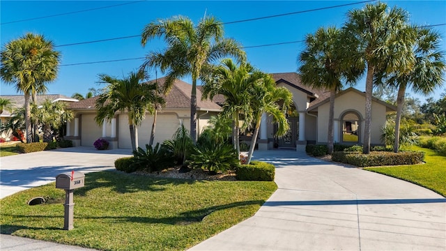 view of front of home featuring a front lawn and a garage