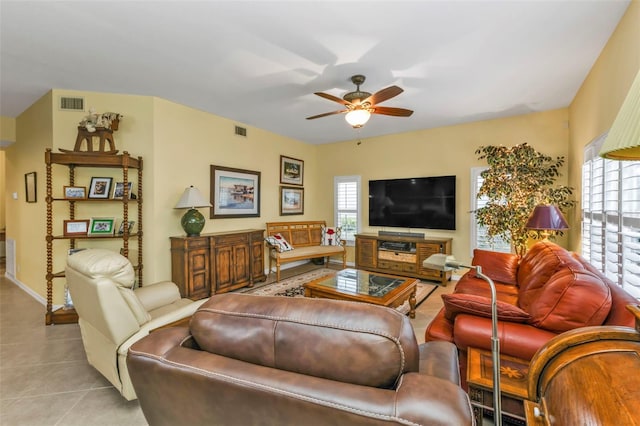 living room with ceiling fan and light tile patterned floors