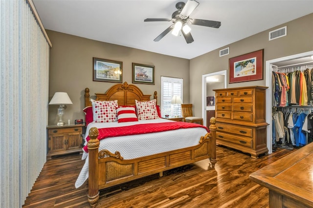 bedroom with a closet, ceiling fan, and dark hardwood / wood-style floors