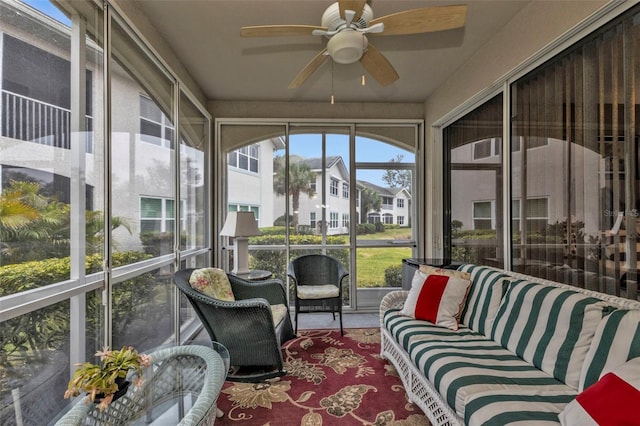 sunroom with ceiling fan and plenty of natural light