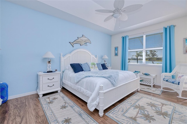 bedroom with hardwood / wood-style flooring and ceiling fan