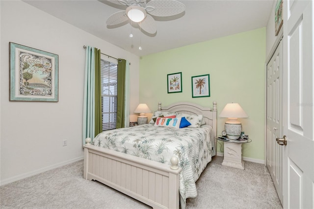 bedroom with light carpet, a closet, and ceiling fan