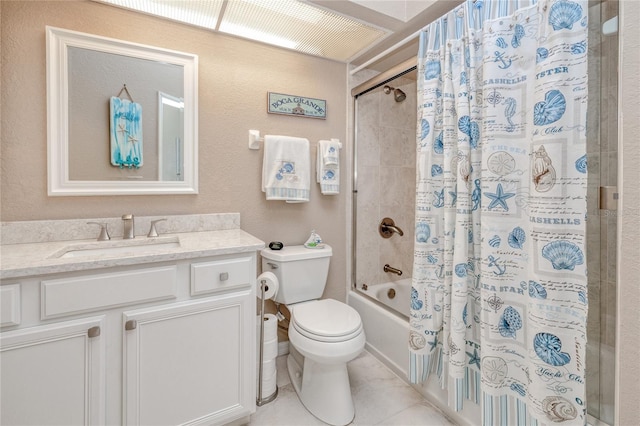 full bathroom featuring toilet, vanity, tile patterned floors, and shower / bath combo with shower curtain