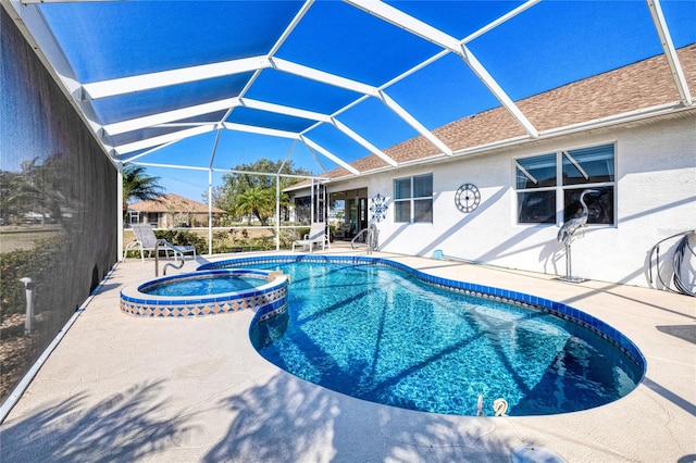 view of swimming pool with a patio area, an in ground hot tub, and glass enclosure