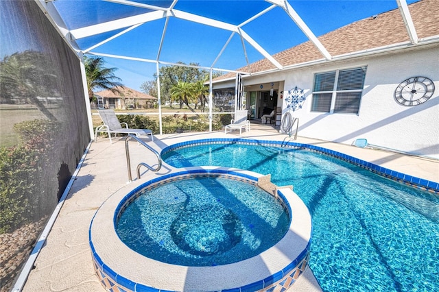 view of swimming pool with a patio and an in ground hot tub