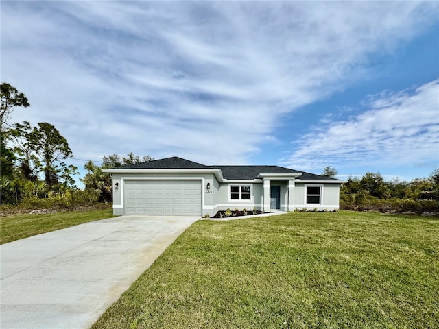 single story home featuring a garage and a front yard