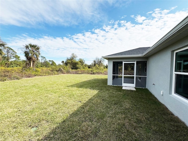 view of yard with a sunroom