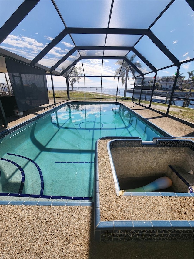 view of pool featuring a lanai and a patio area