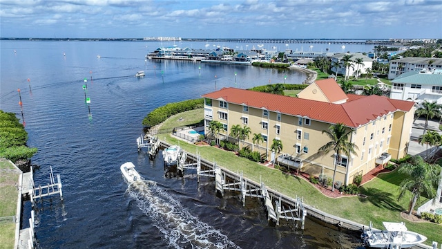 birds eye view of property with a water view