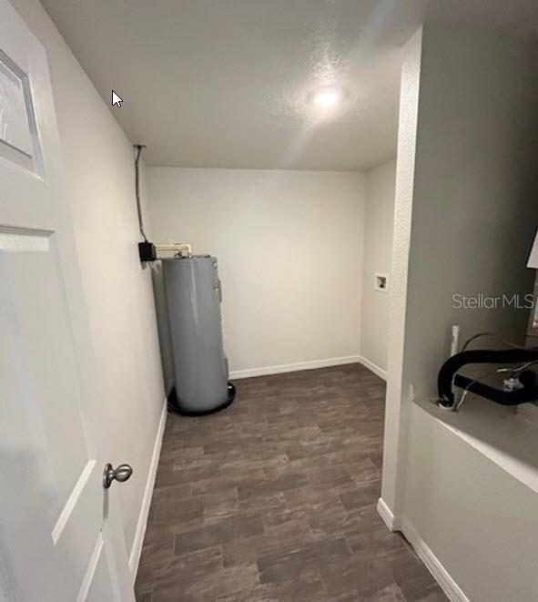 utility room with water heater