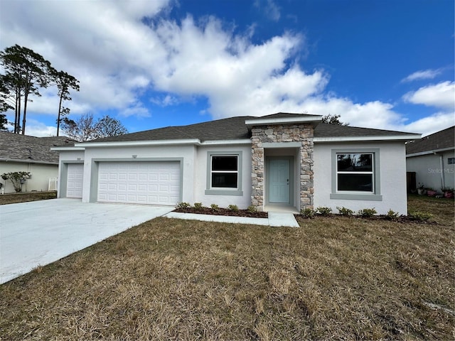 view of front of house with an attached garage, stone siding, driveway, and a front lawn