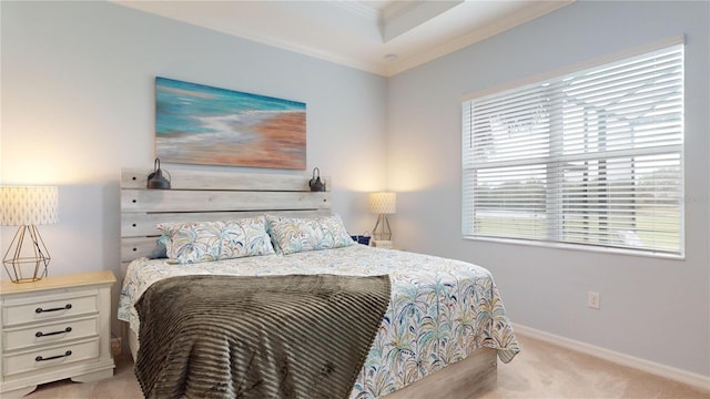 bedroom with ornamental molding, light colored carpet, a raised ceiling, and multiple windows