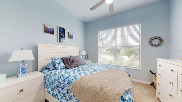 bedroom featuring ceiling fan and light carpet