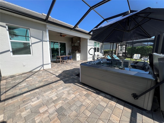 view of patio / terrace with a lanai and ceiling fan